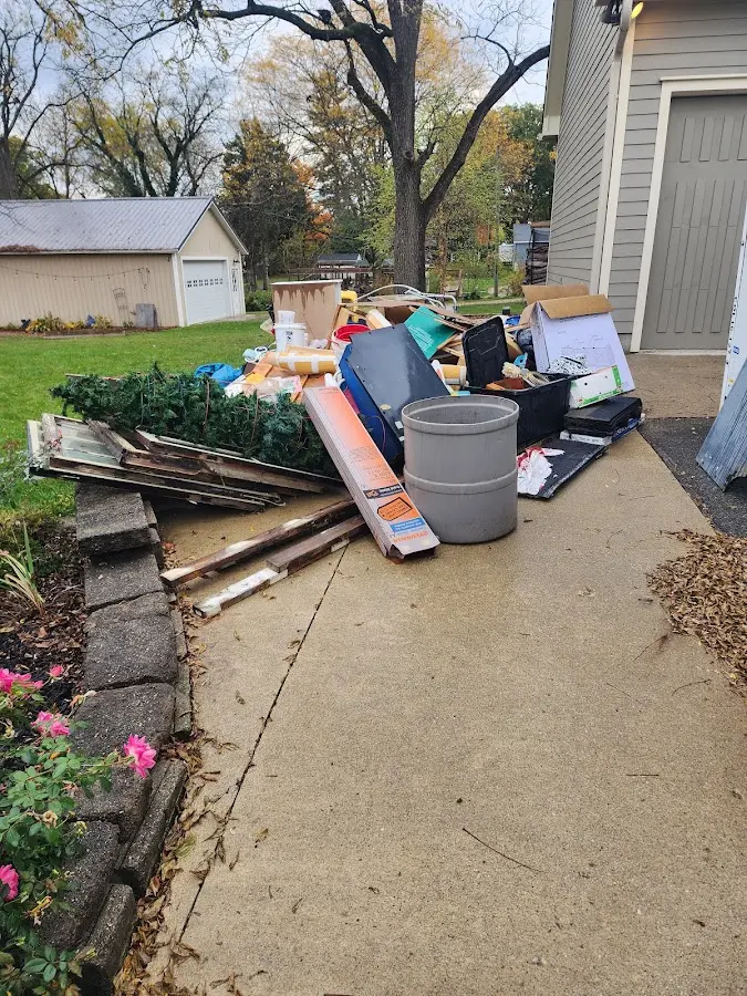 Dumpster being loaded with debris for 3 Yard Dumpster Rental in Monte Sereno
